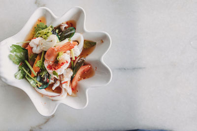 High angle view of salad in plate on table