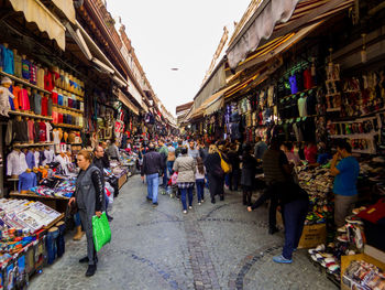 People walking on street market in city