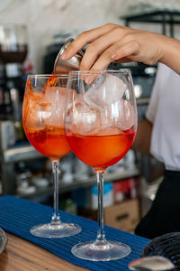 Cropped hand of woman holding wineglass