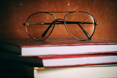 Close-up of eyeglasses on books