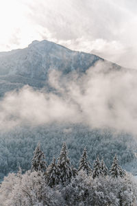 Scenic view of snow covered mountains against sky