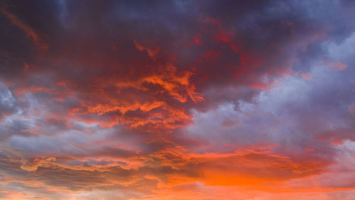 Low angle view of dramatic sky during sunset