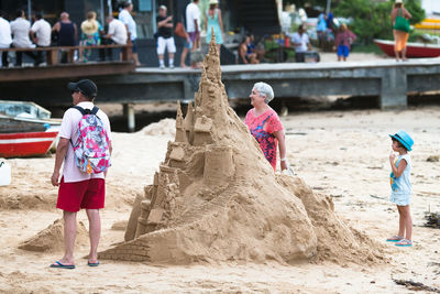 Rear view of people at beach