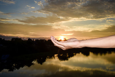 Scenic view of lake against sky during sunset