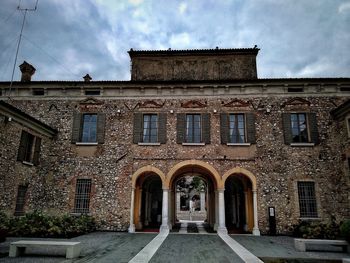 Facade of old building against sky