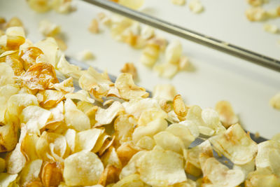 Close-up of potato chips in machine