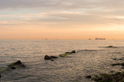 Scenic view of sea against sky during sunset