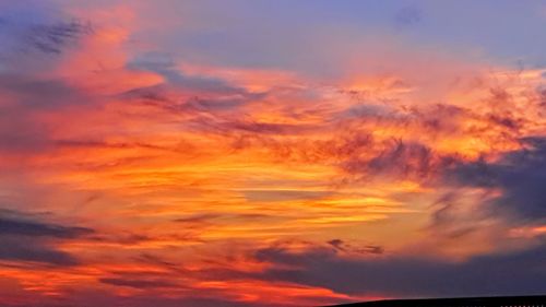 Low angle view of dramatic sky during sunset