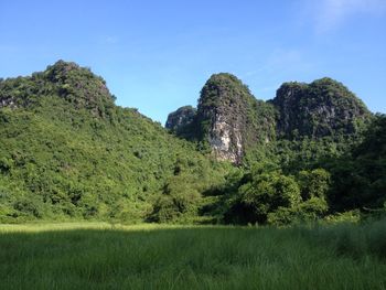 Scenic view of mountains against cloudy sky