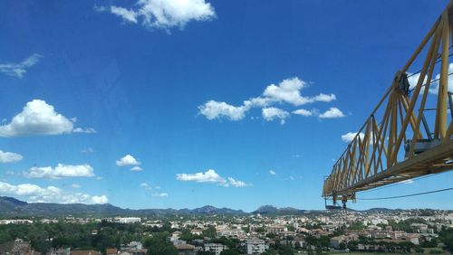 View of cityscape against blue sky