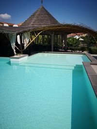 View of swimming pool against blue sky