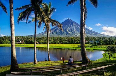 Scenic view of calm lake against blue sky