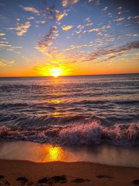 Scenic view of sea at sunset