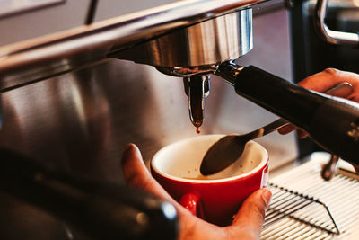 Hand holding coffee cup