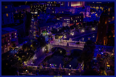 High angle view of illuminated cityscape at night