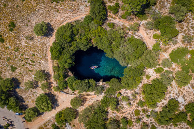 High angle view of hole in shallow water