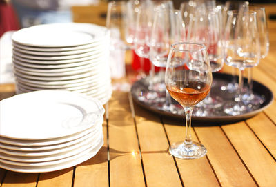 Close-up of wine glasses on table in restaurant