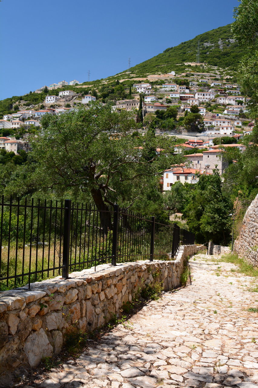 FOOTPATH BY BUILDINGS AGAINST SKY