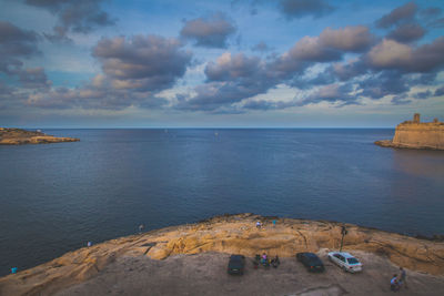 Scenic view of sea against cloudy sky