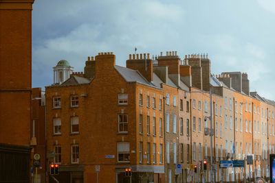 Buildings in city against sky