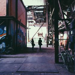 Full length of woman standing in front of building