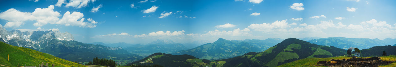 Panoramic view of mountains against cloudy sky