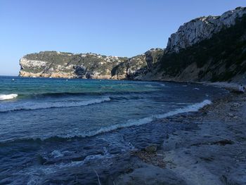 Scenic view of sea against clear blue sky