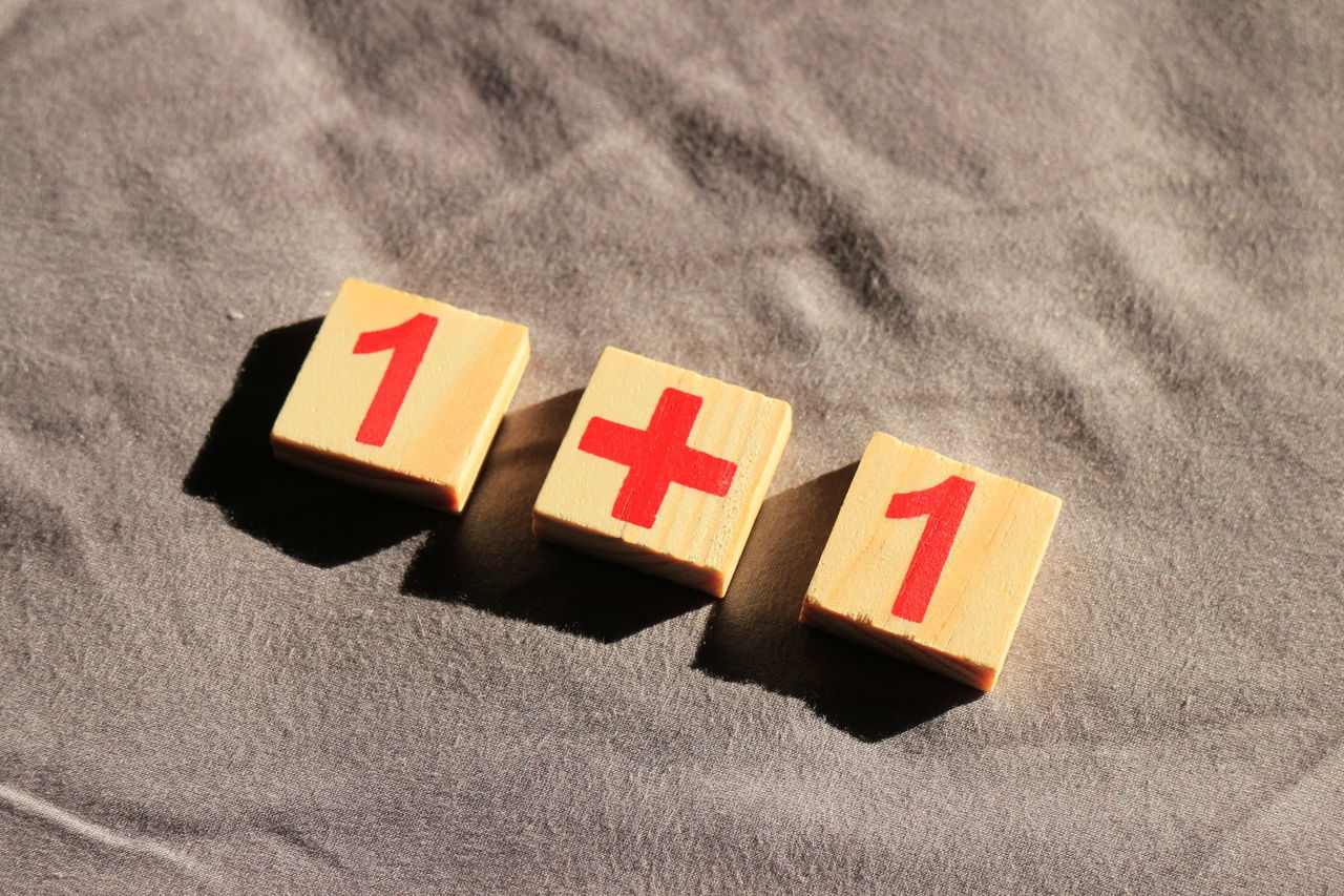 CLOSE-UP OF TOYS ON SAND