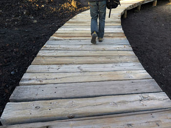 Low section of man walking on footpath