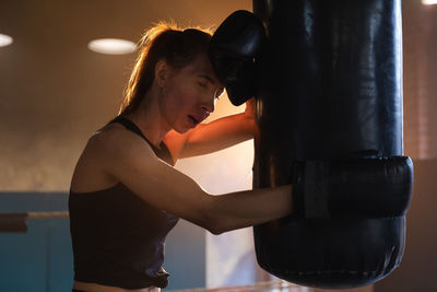 Side view of man exercising in gym