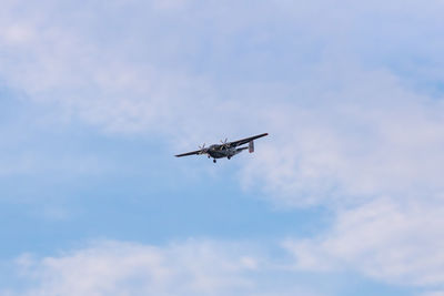 Low angle view of airplane flying in sky