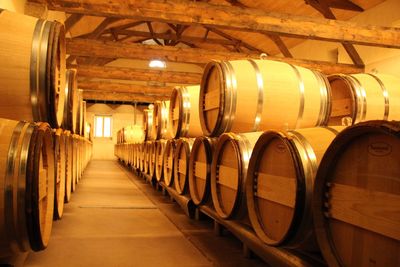 Barrels stacked in wine cellar