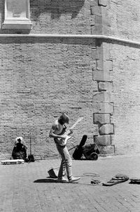 Full length of women on wall