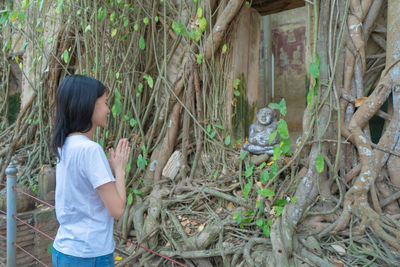 Side view of woman with plants