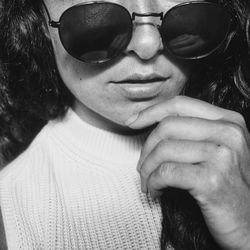 Close-up portrait of young woman wearing sunglasses