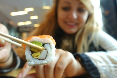 Close-up of woman eating food