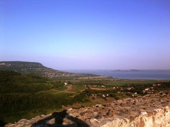 Scenic view of mountains against clear blue sky