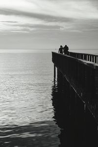 Pier on sea against sky