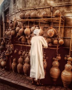 Rear view of man for sale in store