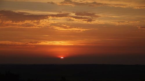 Scenic view of landscape against sky during sunset