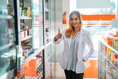 Young woman standing in store