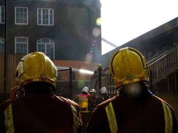 Firefighters against buildings in city