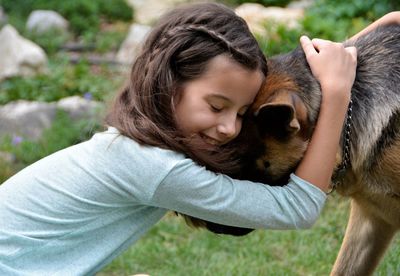 Close-up of cute girl with dog