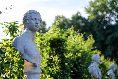 Statues and trees in park