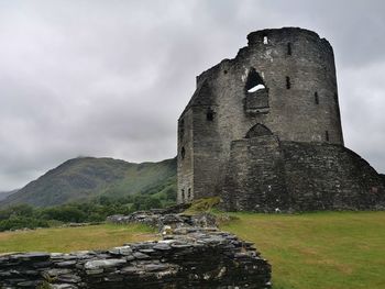 Low angle view of old ruins against sky