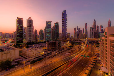 High angle view of illuminated buildings in city against sky