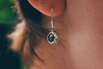 Cropped image of woman wearing earring