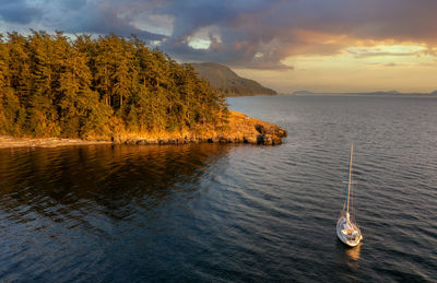 Sailing the san juan islands. aerial shot of a sailboat anchored off of  lummi island, washington.