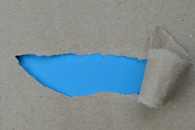 High angle view of blue paper on beach
