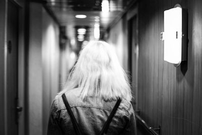 Rear view of woman at subway station